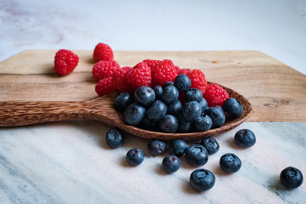Vibrant array of anti-inflammatory foods including berries, leafy greens, and whole grains